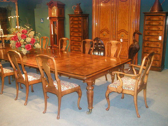 A fine and rare set of 12 English Burr Walnut Queen Anne Dining Chairs .The set comprises of 10 Side Chairs and 2 armchairs