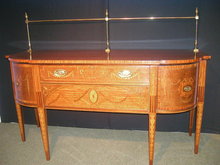 An Important English 19th Century Inlaid Sideboard, in the manner of Sheraton.