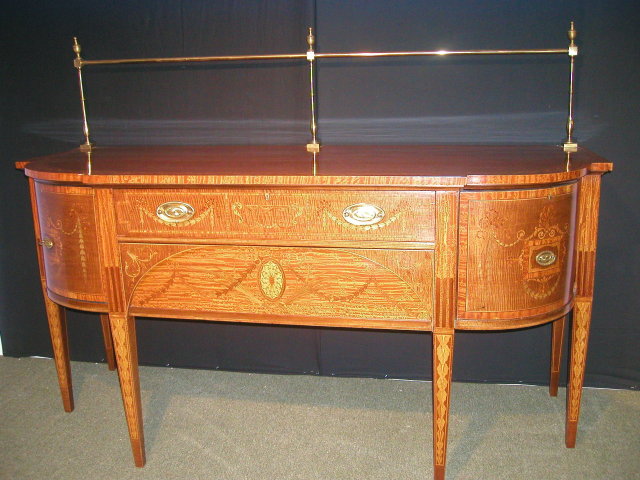 An Important English 19th Century Inlaid Sideboard, in the manner of Sheraton.