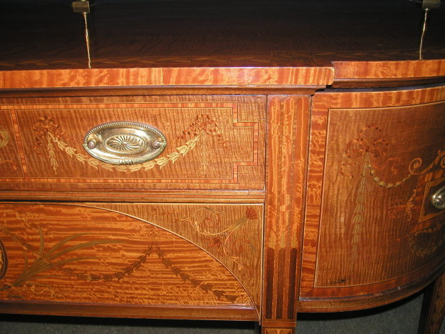 An Important English 19th Century Inlaid Sideboard, in the manner of Sheraton.
