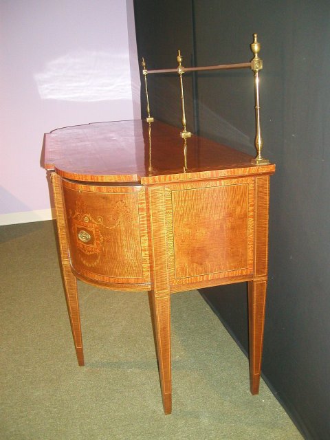 An Important English 19th Century Inlaid Sideboard, in the manner of Sheraton.