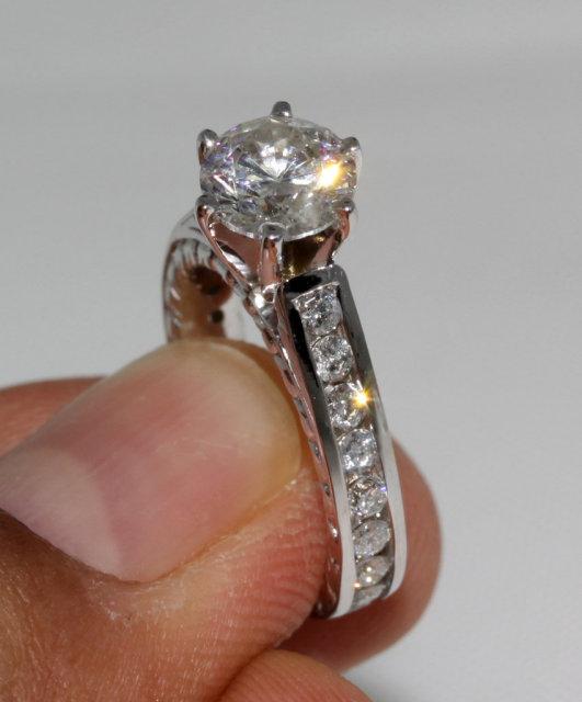 Sparkling diamonds 2.75 ct. solitaire ring with accents