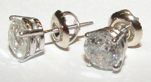 PLATINUM stud earrings in 4.51 carats round G SI1 diamo