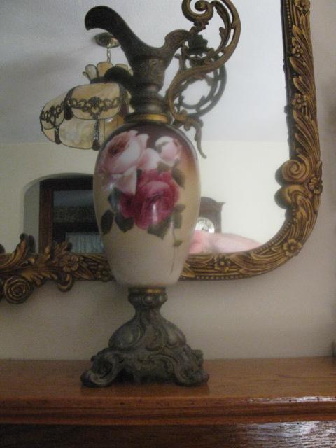 matched pair of hand painted roses ewers