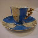 Paneled footed demi cup and saucer