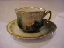 cup and saucer with picture of farm site