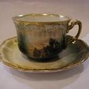 cup and saucer with picture of farm site