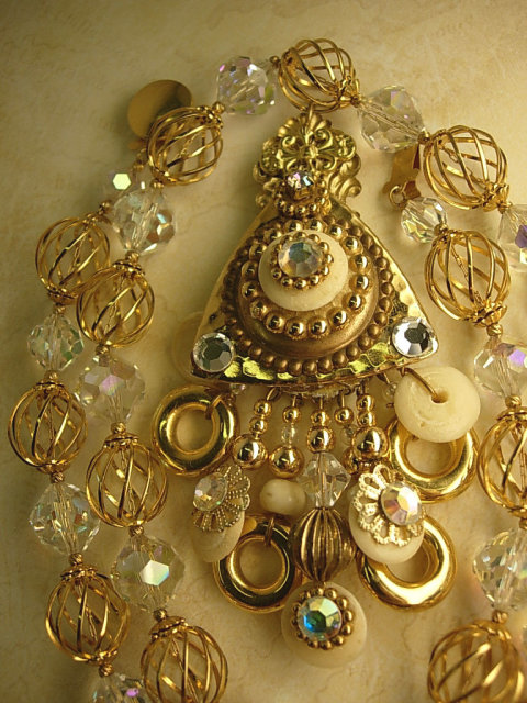 Gorgeous Gypsy necklace Aurora borealis Crystal with golden cages and dramatic tassel pendant