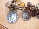 Vintage chunky Charm bracelet South african and Sweden coins and baubles