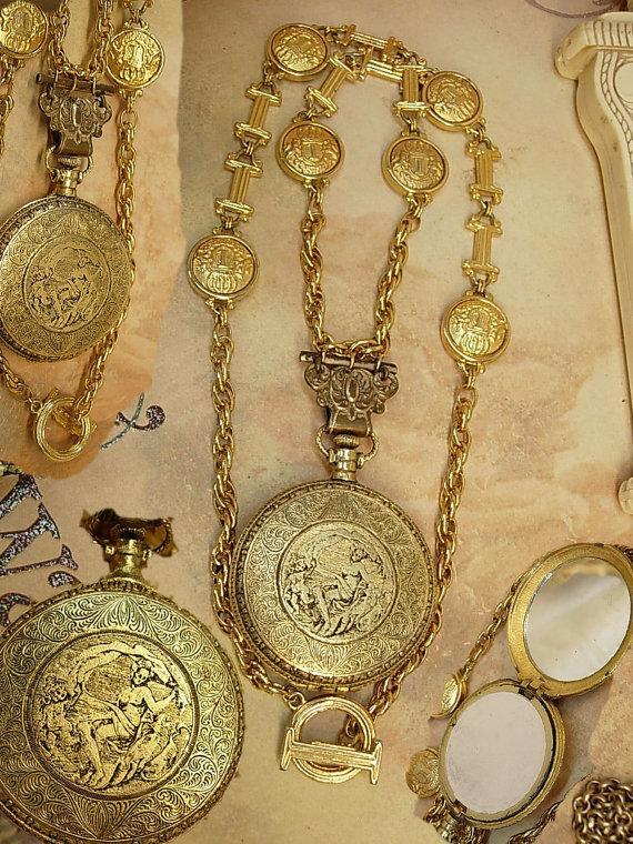 VIntage Nouveau pocketwatch compact necklace with raised nudes and antique hanger