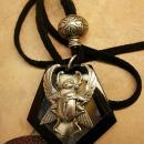 Onyx scarab talisman necklace with eerie agate that catches the moon