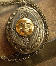 Vintage gunmetal moon locket Whimsical face in mixed metals