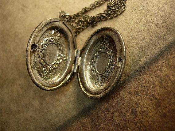 Vintage gunmetal moon locket Whimsical face in mixed metals