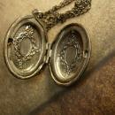 Vintage gunmetal moon locket Whimsical face in mixed metals