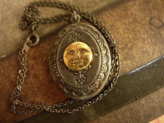 Vintage gunmetal moon locket Whimsical face in mixed metals