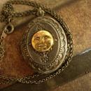 Vintage gunmetal moon locket Whimsical face in mixed metals