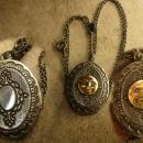 Vintage gunmetal moon locket Whimsical face in mixed metals