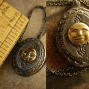 Vintage gunmetal moon locket Whimsical face in mixed metals