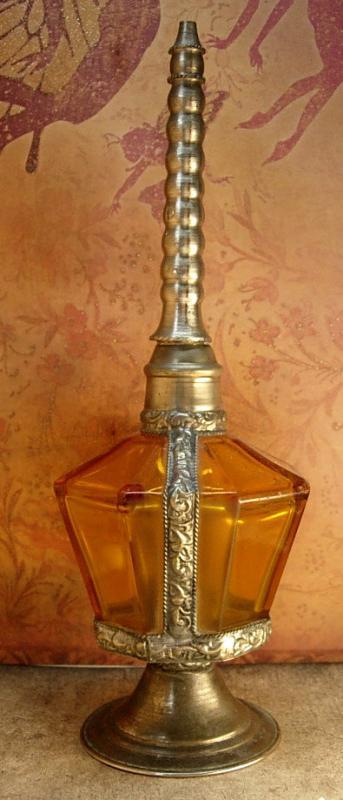 Antique Rosewater bottle signed ornate metalwork with amber glass bottle