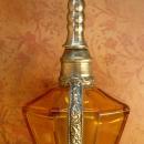Antique Rosewater bottle signed ornate metalwork with amber glass bottle