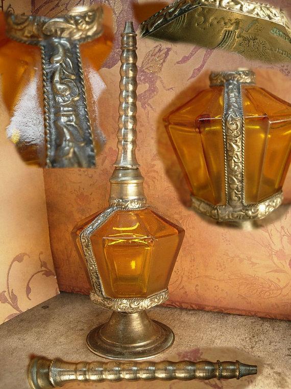 Antique Rosewater bottle signed ornate metalwork with amber glass bottle