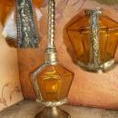 Antique Rosewater bottle signed ornate metalwork with amber glass bottle