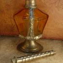 Antique Rosewater bottle signed ornate metalwork with amber glass bottle