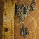 Religious Saint Necklace Vintage rhinestone dress clip antique religious medal goth necklace