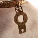 Vintage Charm Bracelet padlock and pocketwatch charms raised relief bangle