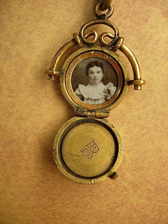 ANtique watch fob locket with little girl photo Flip fob ornate metal work