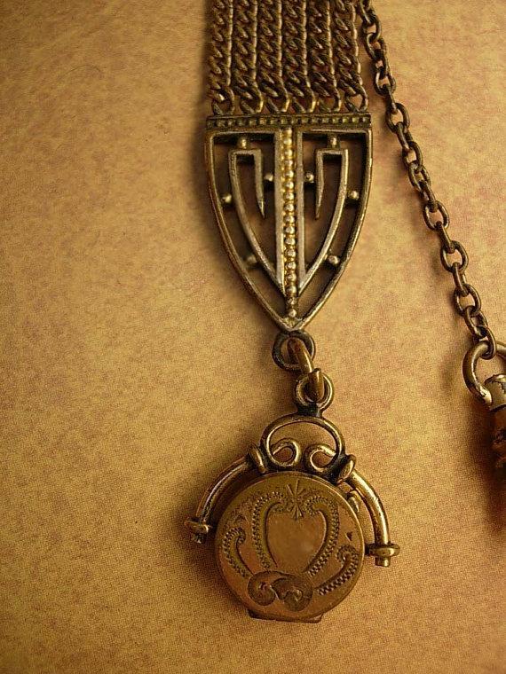 ANtique watch fob locket with little girl photo Flip fob ornate metal work