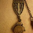 ANtique watch fob locket with little girl photo Flip fob ornate metal work