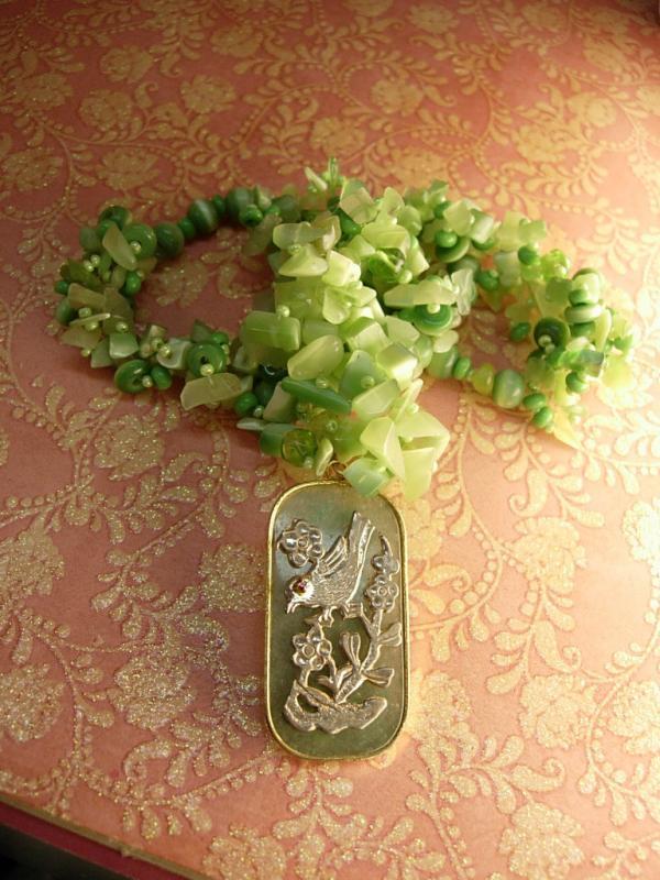 Chunky jade flowered necklace with jeweled bird pendant