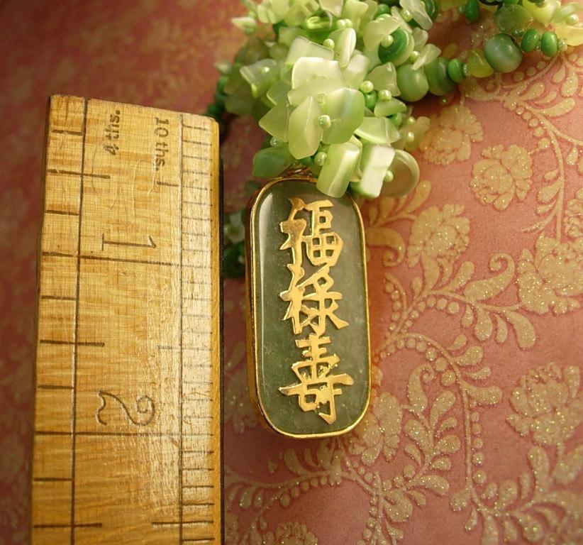 Chunky jade flowered necklace with jeweled bird pendant