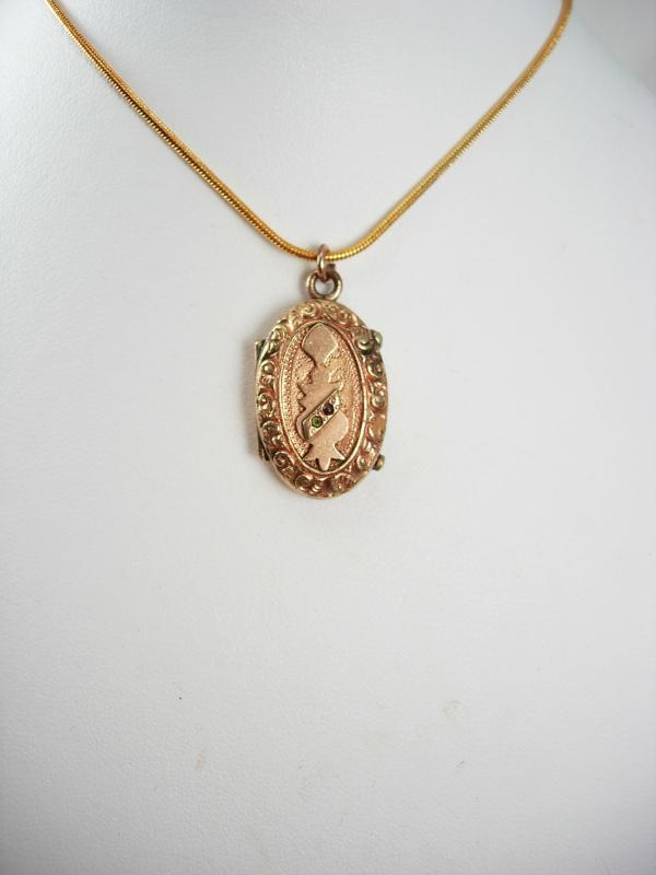 Antique Locket Victorian rose gold filled with garnet and fancy relief necklace