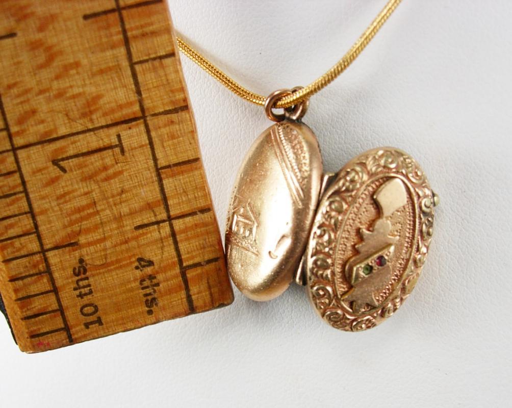 Antique Locket Victorian rose gold filled with garnet and fancy relief necklace