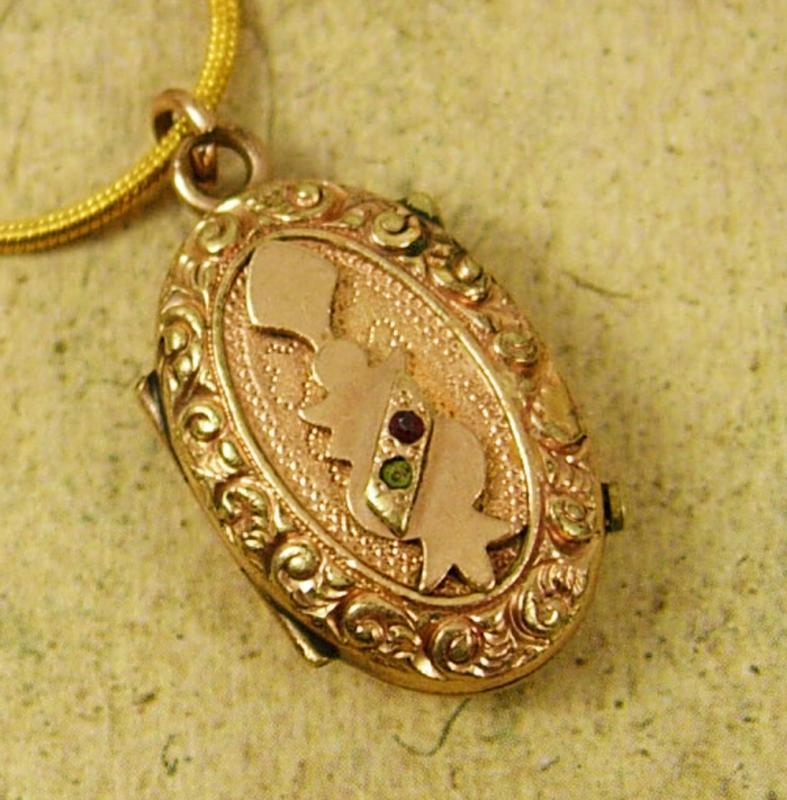 Antique Locket Victorian rose gold filled with garnet and fancy relief necklace
