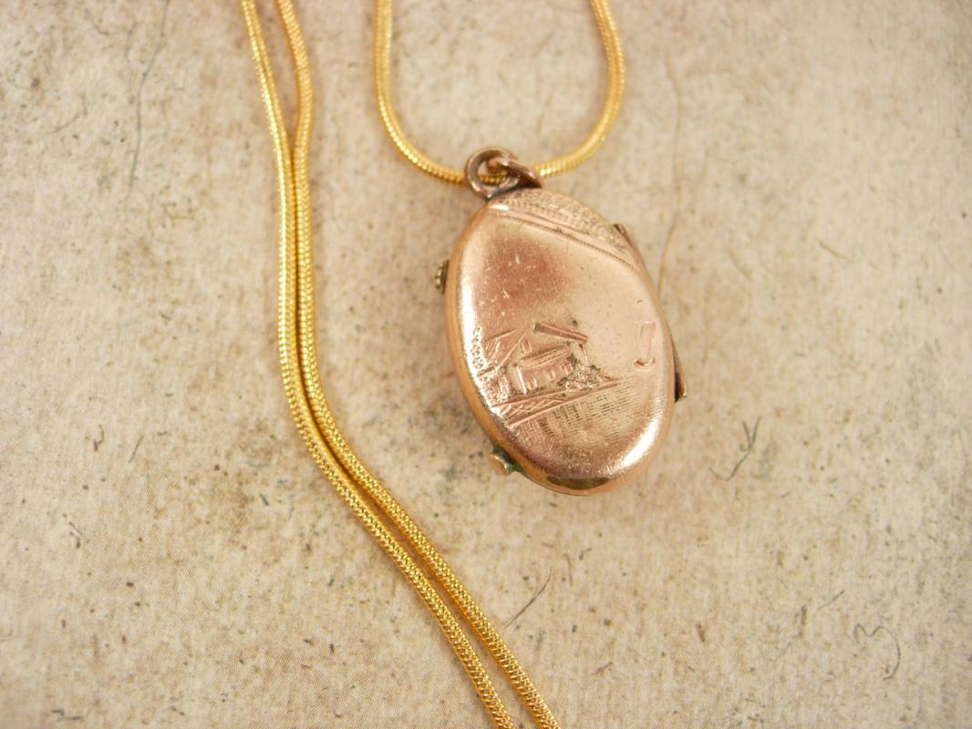 Antique Locket Victorian rose gold filled with garnet and fancy relief necklace