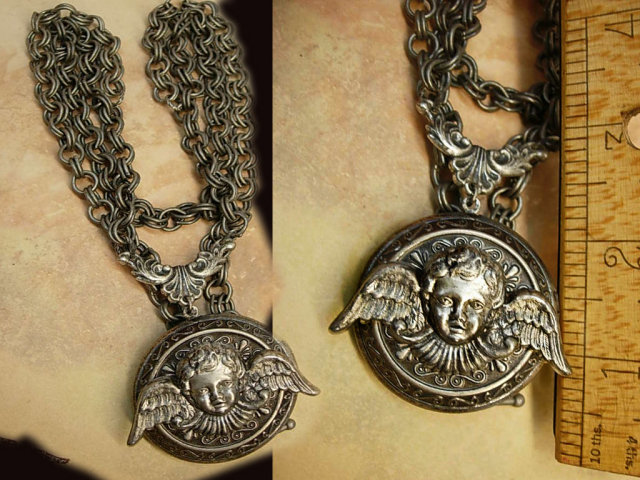 Gothic Winged Cherub locket necklace dripping in gunmetal chain