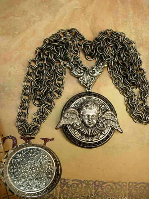 Gothic Winged Cherub locket necklace dripping in gunmetal chain