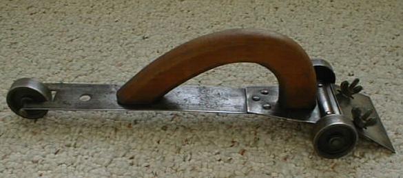 Antique Hand Scraper on Cast Iron Wheels Rare!