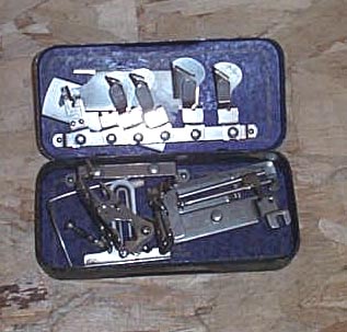 Greist Sewing Machine Attachments in metal box