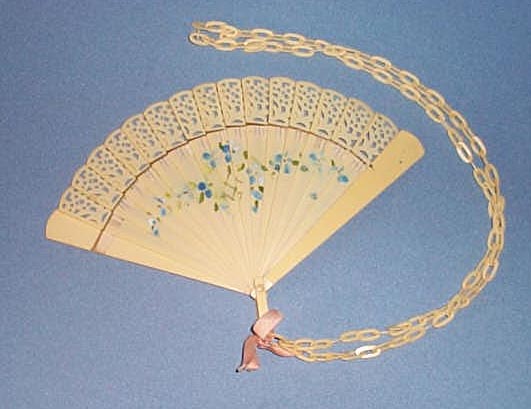 Celluloid ladies fan with floral decoration and chain