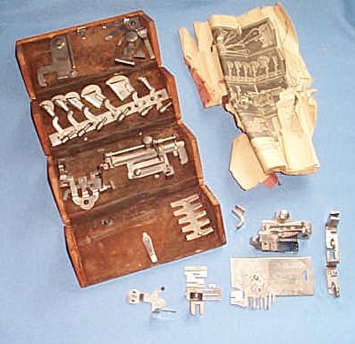 Singer finger-jointed oak box with sewing machine attachments