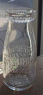 Breuninger Nearby Dairies embossed half-pint milk bottle