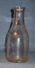 Avondale Farms Dairy Inc. embossed quart milk bottle