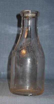 Avondale Farms Dairy Inc. embossed quart milk bottle