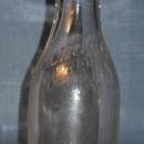 Avondale Farms Dairy Inc. embossed quart milk bottle