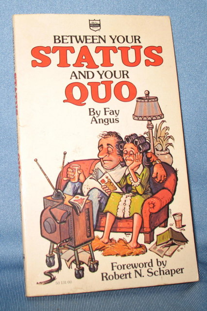 Between Your Status and Your Quo by Fay Angus