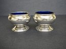 PAIR OF STERLING SILVER SALT & PEPPER CELLARS